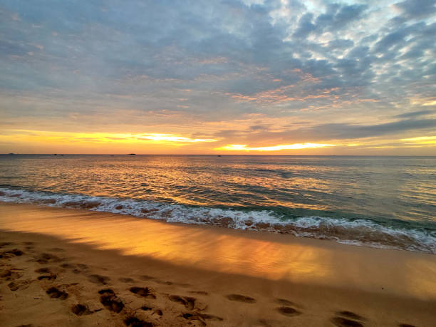 Beautiful sunset on the Gulf of Thailand at Long beach, a sandy beach stretching 20 km on the west coast of Phu Quoc island, Vietnam.