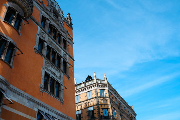 istock Low angle view of buildings against blue sky 2154124390