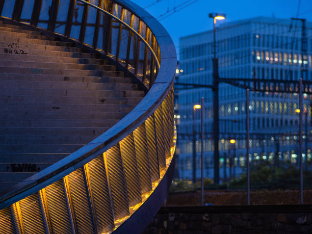 Zurich, Switzerland - May 16, 2024: A tranquil urban evening scene with a modern architectural structure, illuminated stairs, office building,