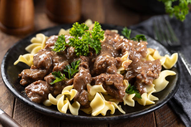 istock Beef stroganoff with egg noodles garnished with parsley 2154129608