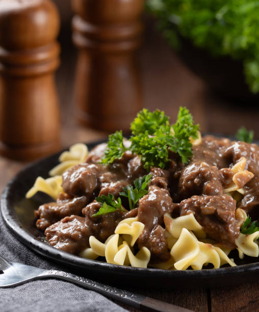 istock Beef stroganoff with egg noodles garnished with parsley 2154129609