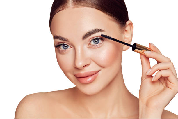 Beauty woman applying black mascara on eyelashes