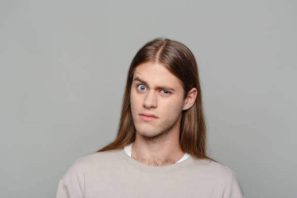 istock Headshot of surprised young man 2154135481