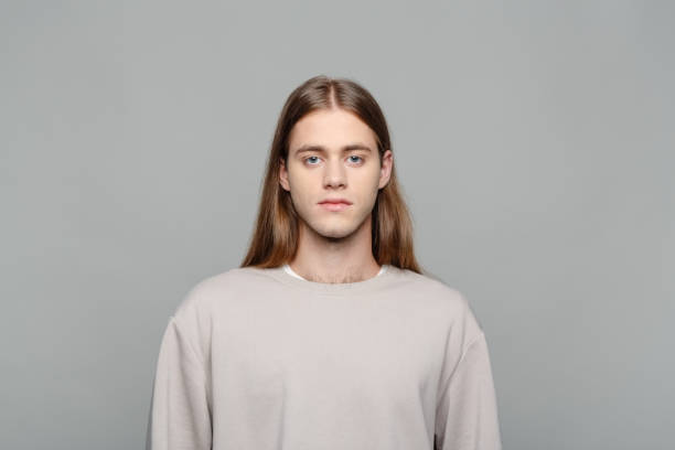 Male beauty. Studio shot of young handsome man isolated on white studio background. Concept of men's health, self-care, body and skin care. Charm, vision, cosmetics