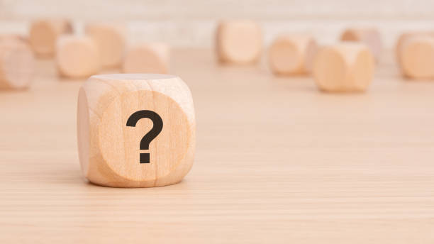 istock A mysterious wooden rectangle with a question mark engraved on it 2154136491