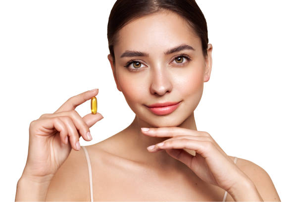 istock Beautiful Girl With Pill With Cod Liver Oil Omega-3 2154138440