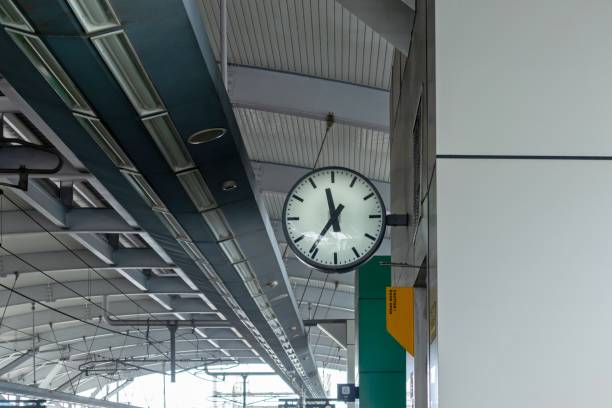 istock View of a station clock. An analog clock hanging on the station wall. 2154139913