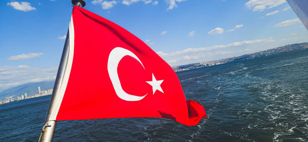 istock Turkish flag waving in the wind on the deck of a ferry 2154141586