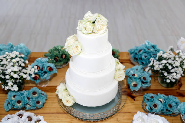istock white birthday cake with four layers and flowers 2154147722