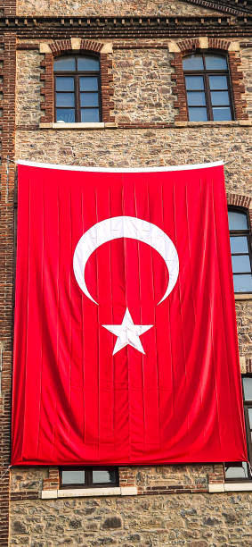 istock A huge Turkish flag is hanged on the wall of a building 2154147826