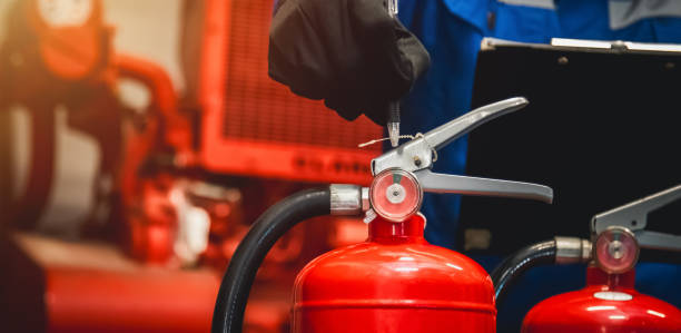 istock Engineer check fire extinguisher tank in the fire control room for safety in factory or industry. 2154150636