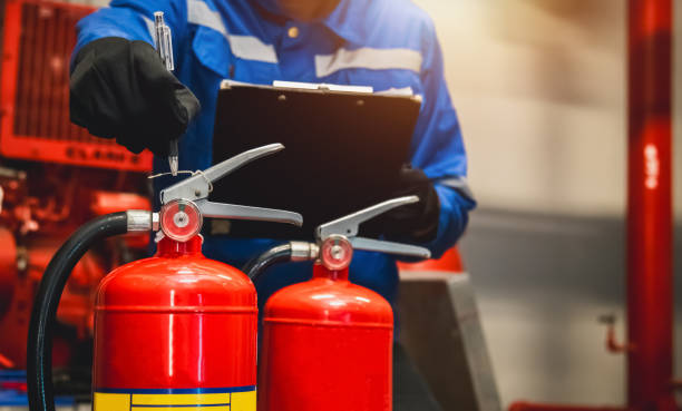 istock Engineer check fire extinguisher tank in the fire control room for safety in factory or industry. 2154150822