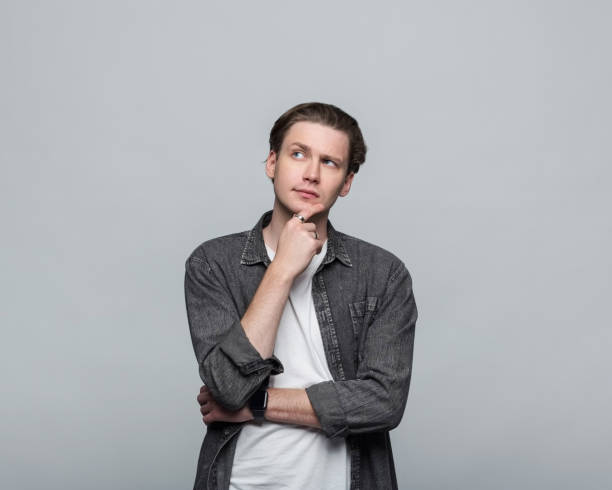 istock Portrait of thoughtful young man 2154151193