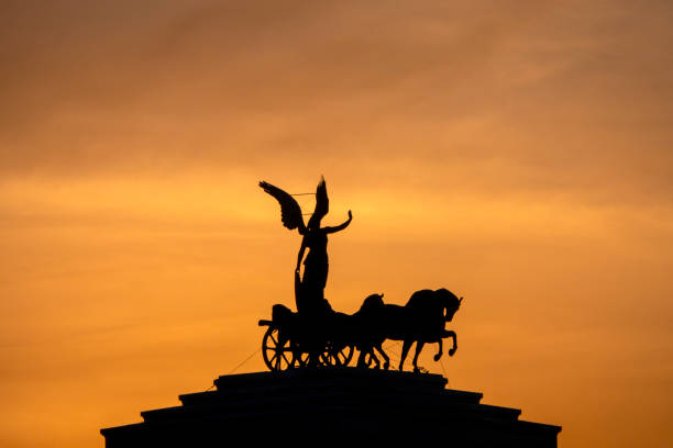 Bronze statue of the Winged Victory on chariot located on the top of Vittorio Emanuele monument in Rome. Italy.\u2028http://www.massimomerlini.it/is/vittoriano.jpg\u2028http://www.massimomerlini.it/is/romebynight.jpg\u2028http://www.massimomerlini.it/is/rome.jpg\u2028http://www.massimomerlini.it/is/vatican.jpg
