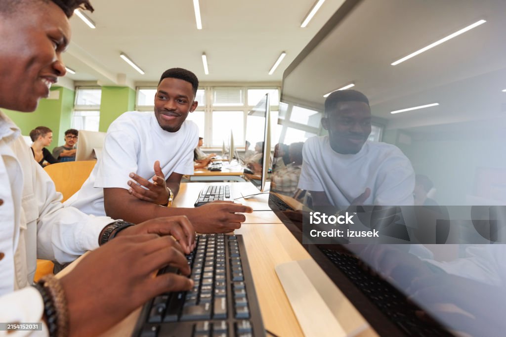 Computer Lab Pjoto Students Discussing During Coding Lesson In Computer Lab Stock Photo ...
