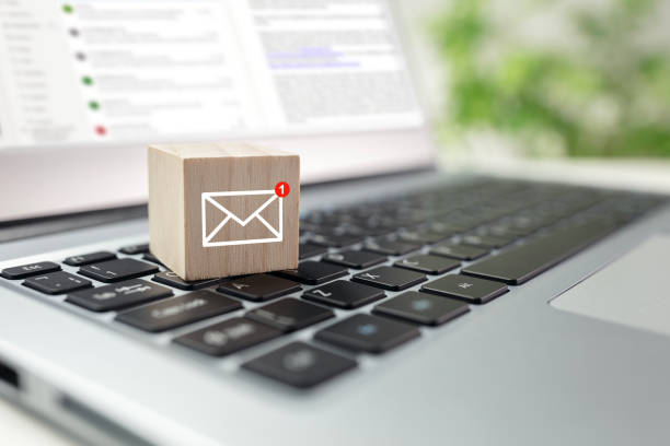 istock New email symbol on wooden block on laptop keyboard 2154152900