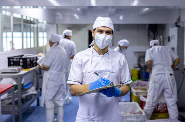 istock Man working at the butcher's shop taking inventory 2154154909