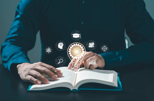 istock Graduation hat with light bulb on books and learning icons in classroom e-learning concept Education and e-learning technology, business education to increase personal skills and knowledge. 2154155106
