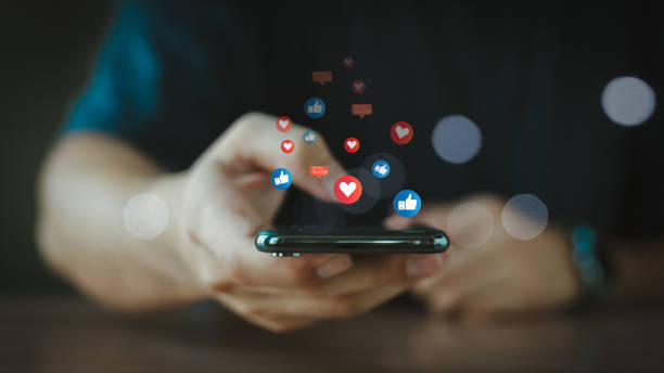 istock Hand using smartphone with Social media concept. Digital Marketing Media Technology Graphic Concept. Digital marketing media (website ad, email, social network, SEO, video, mobile app) 2154155180