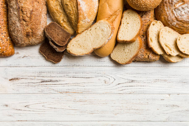 istock Homemade natural breads. Different kinds of fresh bread as background, top view with copy space 2154155252