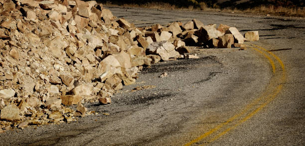 istock Rock Avalanche on Road Roadway Drive Blocking Traffic 2154156209
