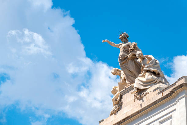Neo classic statue on top of the Palazzo delle Esposizioni, Rome, Italy