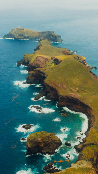 istock Aerial View of Majestic Greed Cliffs Surrounded by Ocean 2154157330