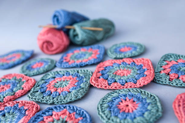 istock Closeup of crochet granny squares on grey surface. 2154158117