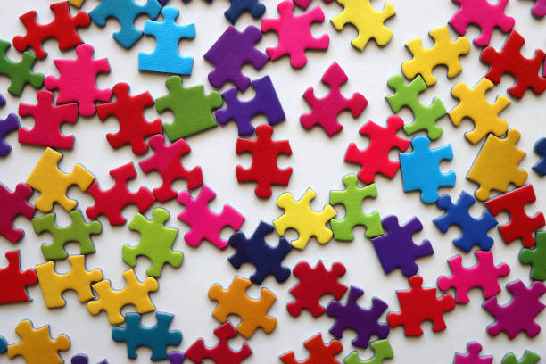 istock Colorful Jigsaw Puzzle Pieces 2154163735