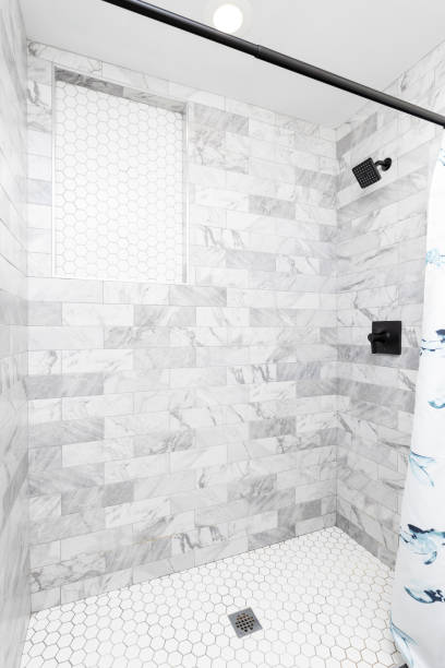 istock A luxury shower with subway and hexagon tiles. 2154163978