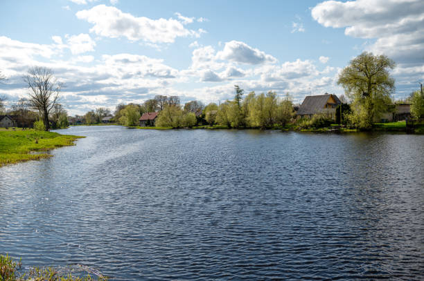 View of the river and the village. Spring landscape. Zagare, Lithuania