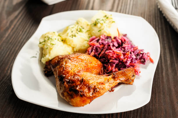istock baked chicken leg, mashed potatoes and red cabbage salad 2154169166