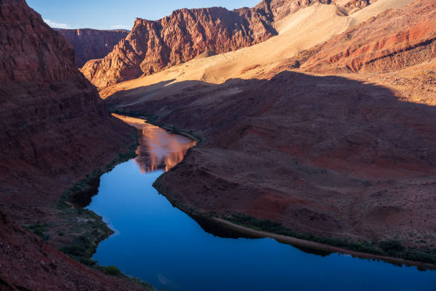 Colorado river snaking through hills before meeting the Hoover dam on the border of Arizona and Nevada states in USA. Takes care of vast parched land in both states.