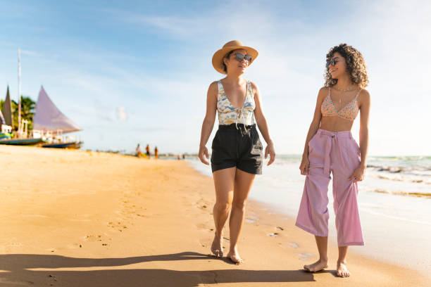 istock Mother and daughter on the beach topical 2154173290