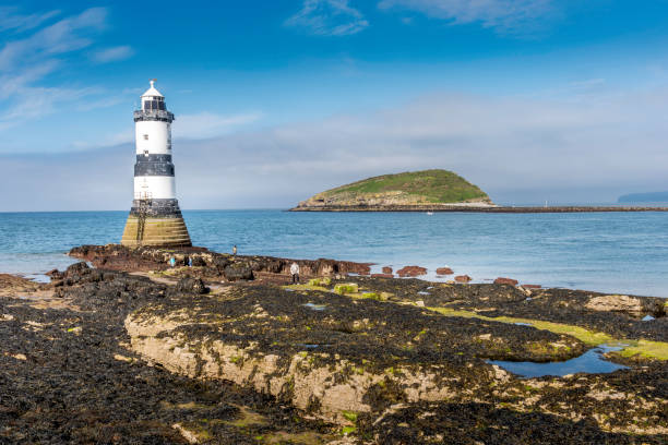 istock Trwyn Du Lighthouse and Puffin Island Anglesey, Wales 2154173839