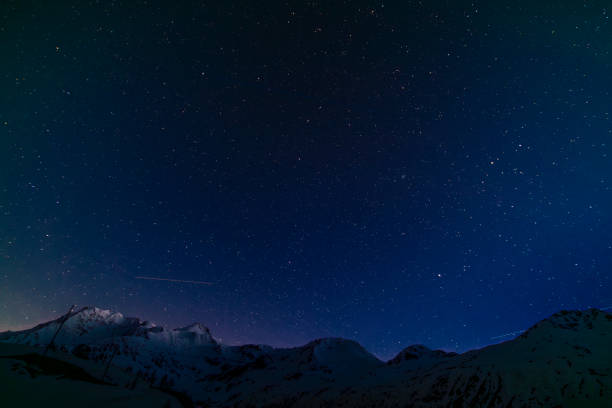 istock Night blue sky in spring evening with snow and star lights 2154174051