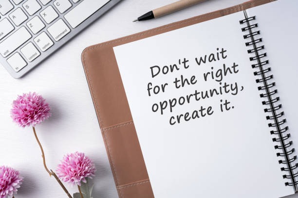 istock Notepad and inspirational quote don't wait for right opportunity, create it 2154174408