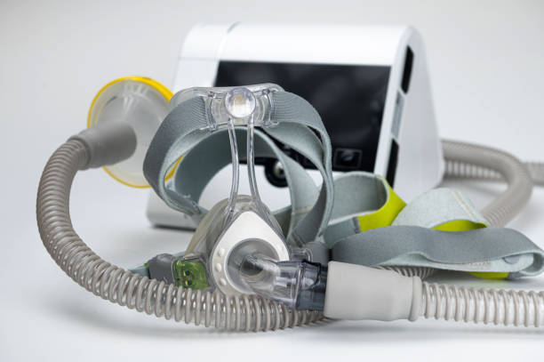 istock Continuous positive airway pressure system includes of CPAP machine, mask, tube on white background. 2154174519