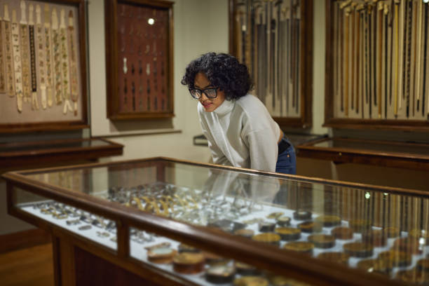 visitor in historical museum looking at art object