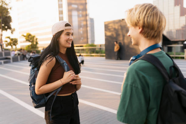 istock Two university students enjoying a conversation outdoors 2154176538