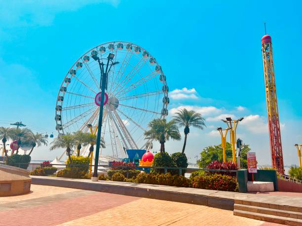 istock Downtown Entertainment District with Ferris Wheel and a bright blue sky 2154176956
