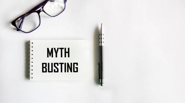 istock Notepad with the inscription MYTH BUSTING on a white background with a pen and glasses. Information concept with copy space for educational poster or presentation. 2154178679
