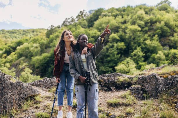 istock Diverse friends enjoying a scenic mountain hike 2154180053