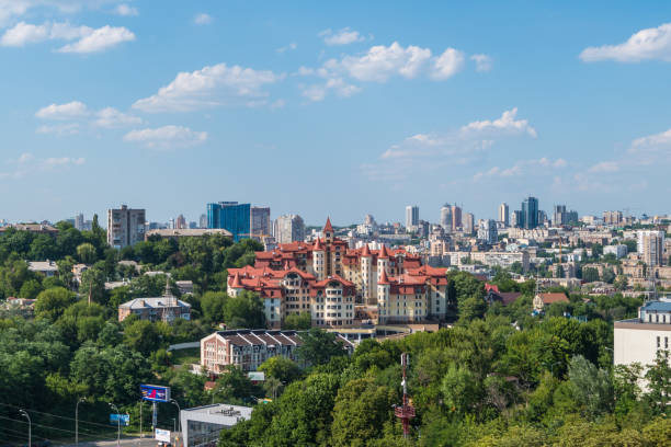 istock Cityscape featuring a modern urban skyline with lush greenery under a clear blue sky 2154181083