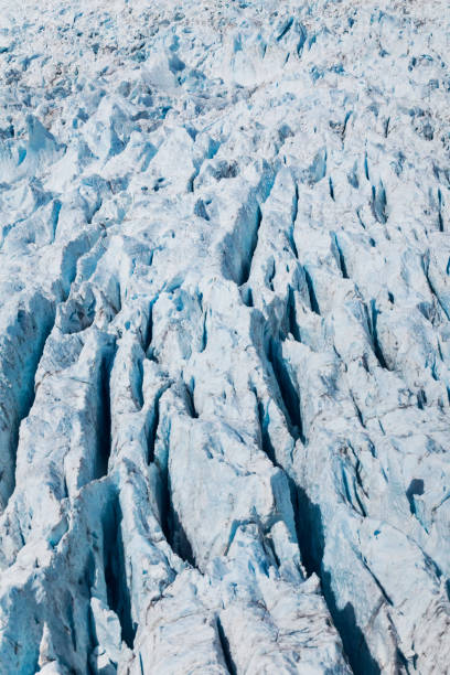 Aerial View of Franz Josef Glacier in the Southern Alps of New Zealand Aerial shot of Franz Josef Glacier in the Southern Alps mountains of New Zealand. seracs stock pictures, royalty-free photos & images