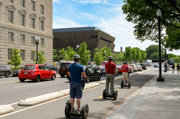 Washington DC, USA - 30 April 2024: Group of people riding on Segway self balancing vehicles on a sightseeing trip around the city