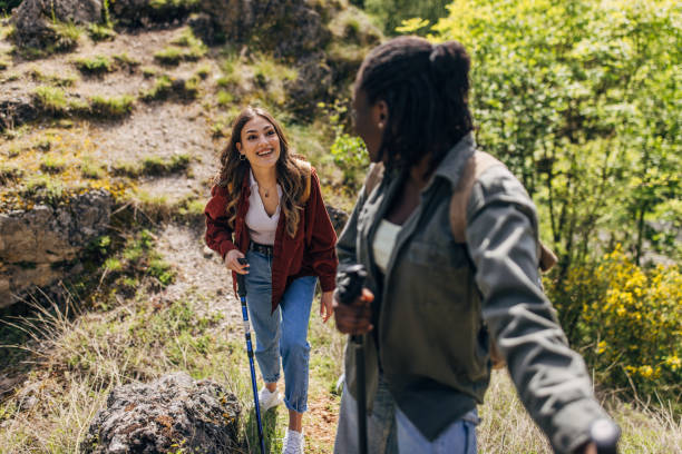 istock Joyful friends on a mountain hiking adventure 2154181611