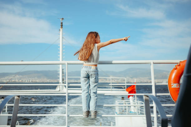 istock Little girl is on a ship, boat or ferry. 2154184648