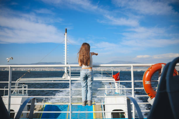 istock Little girl is on a ship, boat or ferry. 2154184875