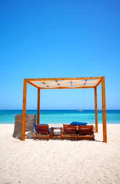 istock Tropical sandy beach on a sunny day, summer vacation concept. 2154188735